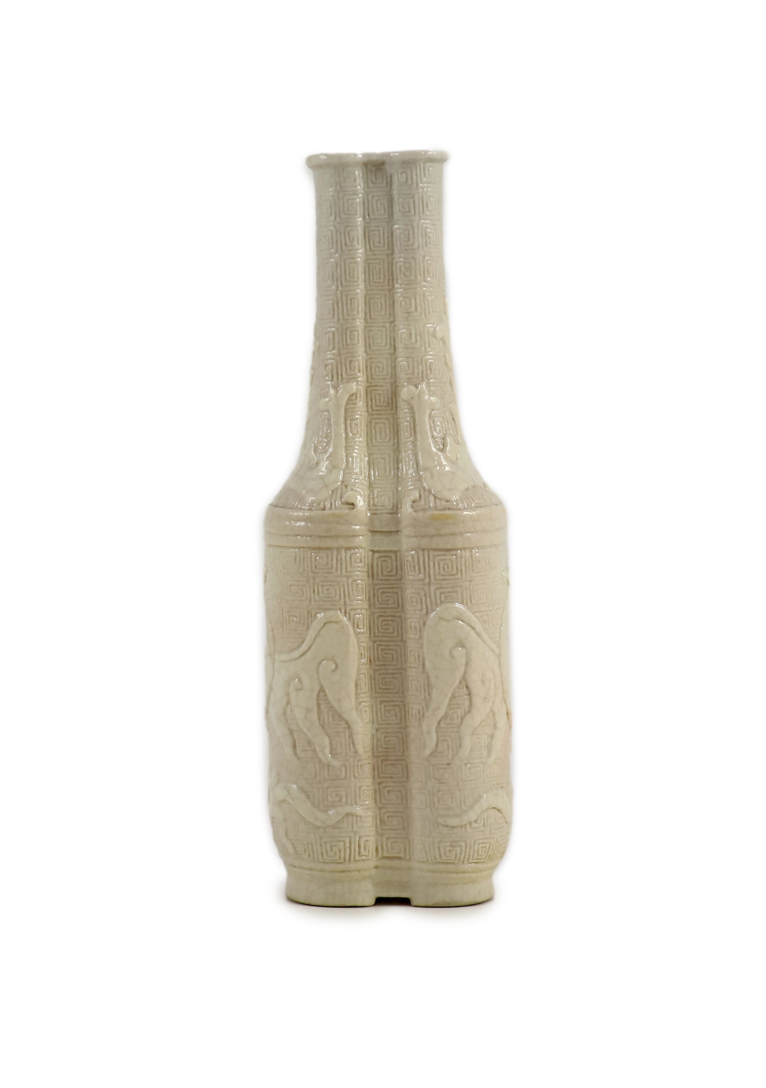 A small Chinese moulded and slip-decorated porcelain double-sided vase, Qianlong mark and period (1736-95), 14 cm high